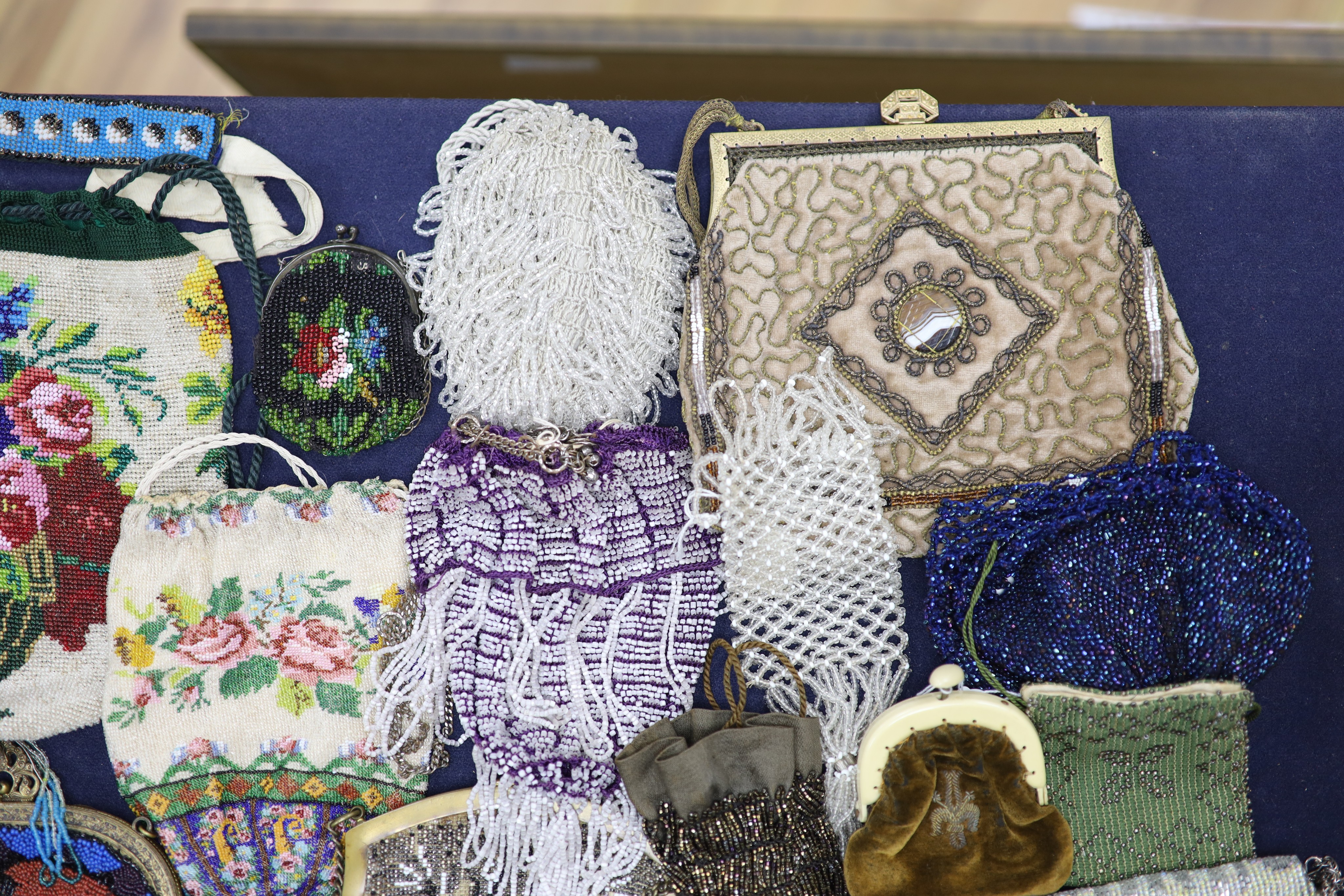 A collection of approximately fifty Victorian and later beadwork, white metal and fabric purses etc.